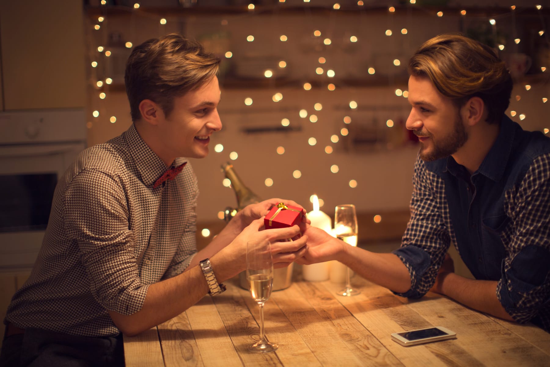 Young man gives Valentine's Day gift to partner.